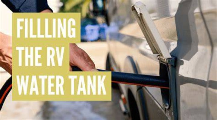 How do I fill the hot water tank on my RV?