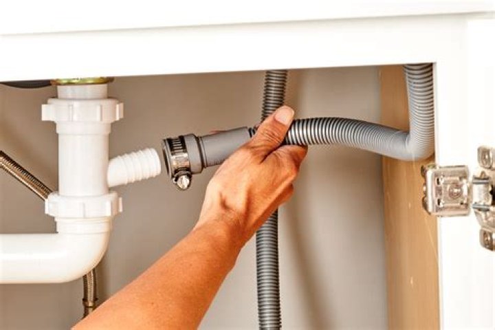 How do I replace the hose under my kitchen sink?