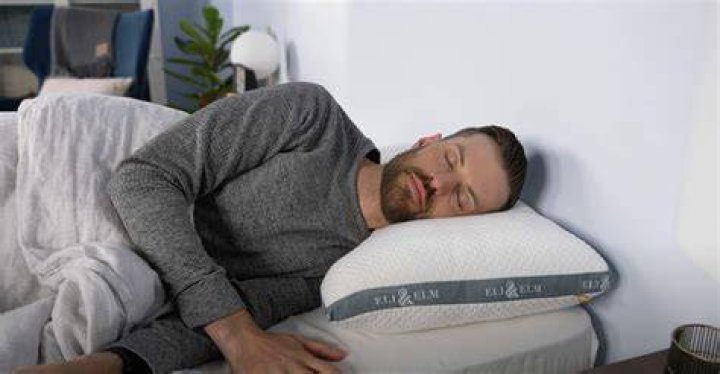 How do you prop someone up in bed with pillows?