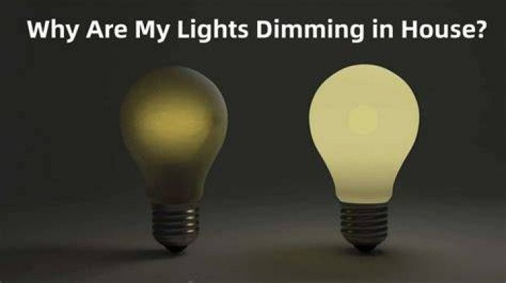 What causes lights in a house to dim and then go bright?