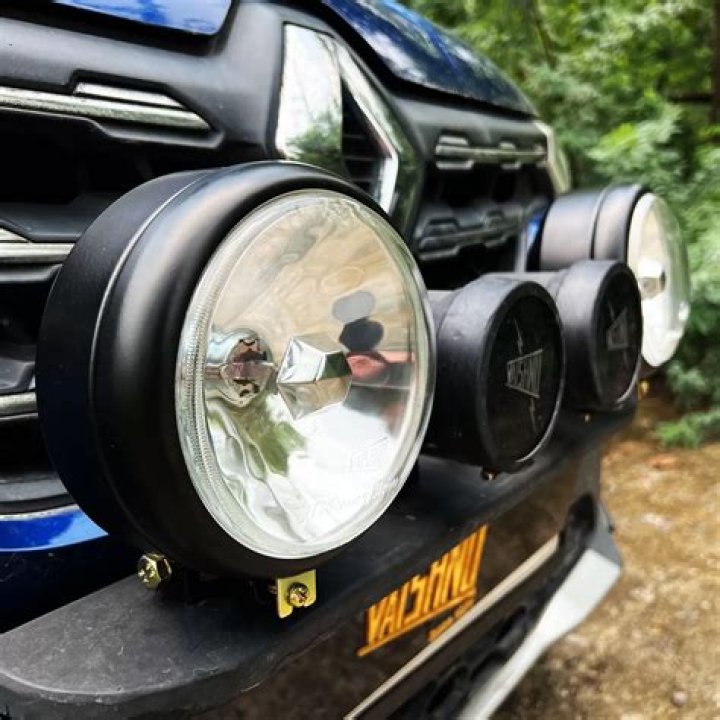 What is the law about headlights and auxiliary lights?