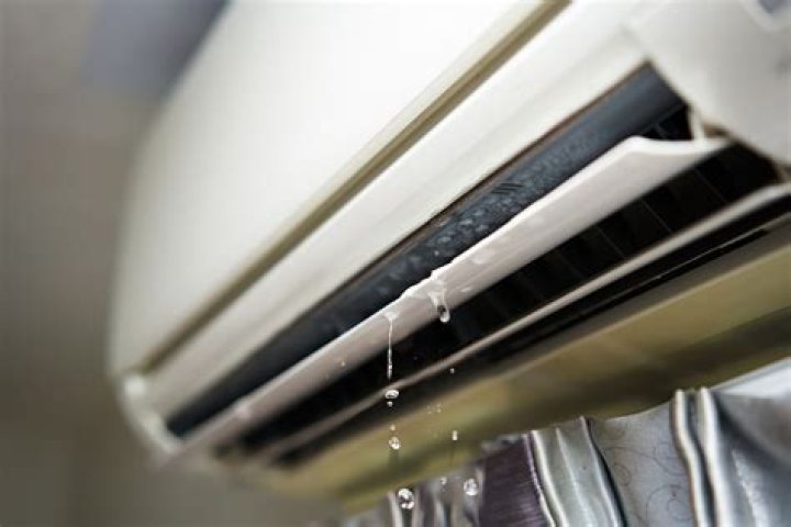 Why is my portable AC leaking water from the bottom?